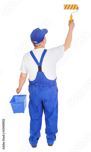 Photo: house painter is painting invisible wall house painter is painting invisible wall