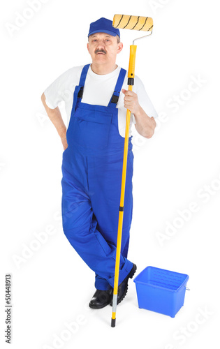 Photo: Painter in blue dungarees Painter in blue dungarees
