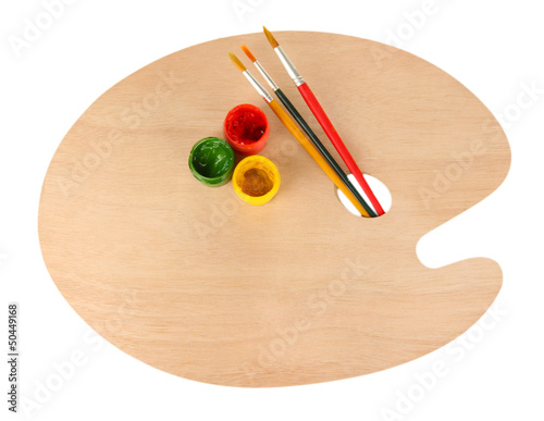 Photo: Wooden art palette with brushes for painting and paints Wooden art palette with brushes for painting and paints