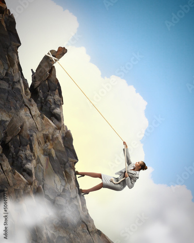 Photo: businesswoman climbing mountain businesswoman climbing mountain