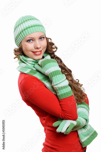 Photo: Young woman wearing winter hat and warm scarf Young woman wearing winter hat and warm scarf