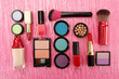 Decorative cosmetics on pink background
