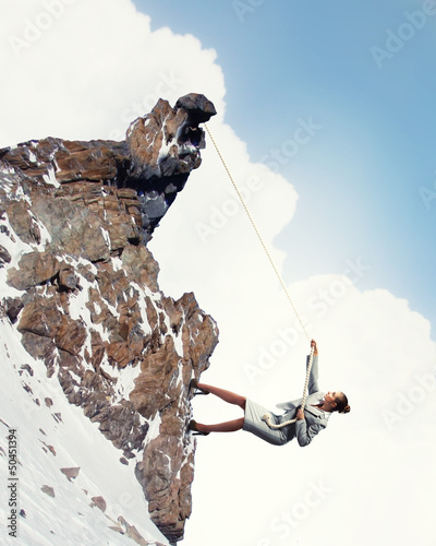 Photo: businesswoman climbing mountain businesswoman climbing mountain