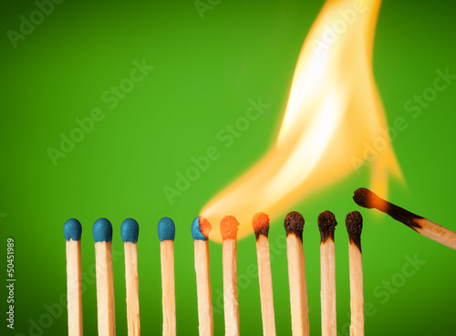 Photo: concept with matches- chain reaction concept with matches- chain reaction