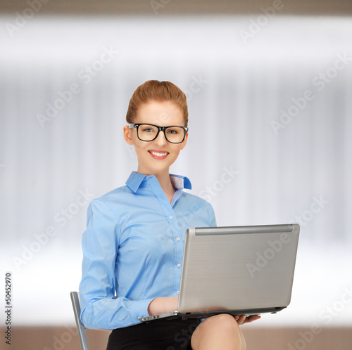 Photo: happy woman with laptop computer happy woman with laptop computer