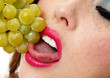 Woman Eating Grapes Close Up