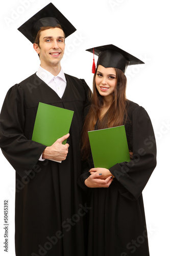 Photo: Two happy graduating students holding graduation certificate Two happy graduating students holding graduation certificate