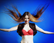Fashion model with hair blowing in the wind