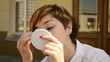 young woman paints the eyelashes and eyebrows