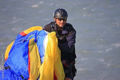 Photo: paraglider carrying his wing paraglider carrying his wing