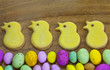 Easter iced cookies and chocolate eggs border.