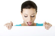 Shocked woman holding blank board