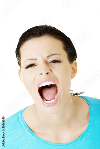 Photo: Young woman screaming with anger Young woman screaming with anger