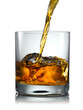 Foto: Pouring Scotch Whisky in Glass with perfect ice Pouring Scotch Whisky in Glass with perfect ice