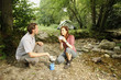 Couple preparing food outdoors - camping serie