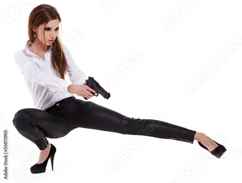 Photo: Sexy girl holding a black gun Sexy girl holding a black gun