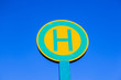 bus stop sign under blue sky