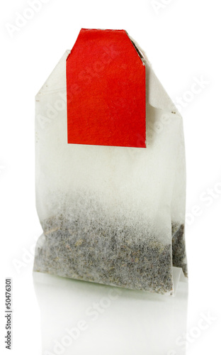 Photo: Tea bag isolated on white. Tea bag isolated on white.