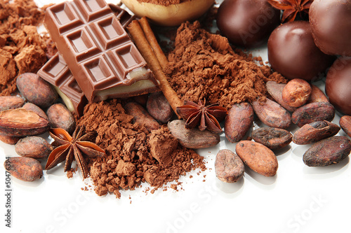 Photo: Composition of chocolate sweets, cocoa and spices, isolated Composition of chocolate sweets, cocoa and spices, isolated