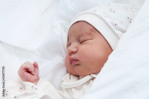 Photo: Newborn girl in the maternity hospital Newborn girl in the maternity hospital