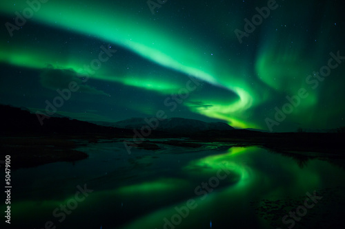 Photo: Northern lights above lagoon in Iceland Northern lights above lagoon in Iceland