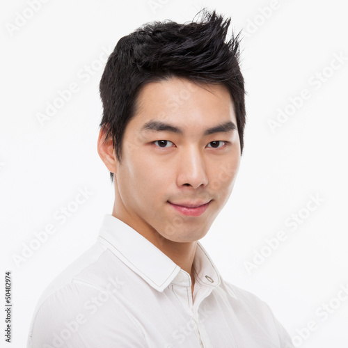 Photo: Young Asian man close up shot. Young Asian man close up shot.