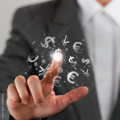 Photo: Investment concept. Pretty business woman with currency symbols. Investment concept. Pretty business woman with currency symbols.