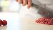 chef cutting meat in kitchen dolly shot