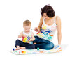 mother wih kid boy drawing and painting together