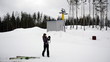 Skier photographs at mountain top