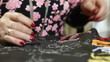 Woman doing beadwork