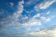 The white cumulus clouds against the blue sky