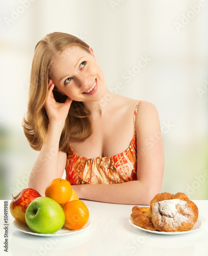 Photo: woman choose between healthy and unhealthy food woman choose between healthy and unhealthy food