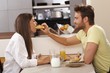 Loving couple having breakfast together