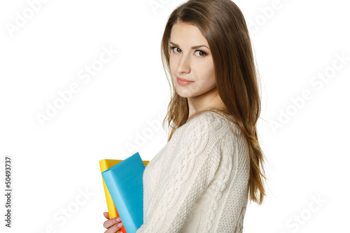 Photo: Closeup of calm woman holding books Closeup of calm woman holding books