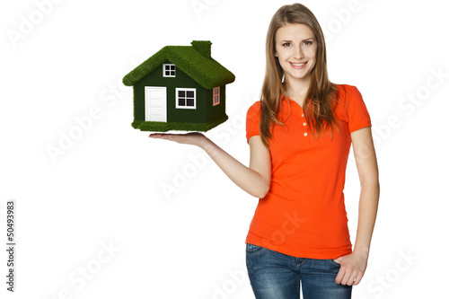 Photo: Happy female holding green eco house Happy female holding green eco house