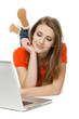 Front view of  female lying on the floor with laptop