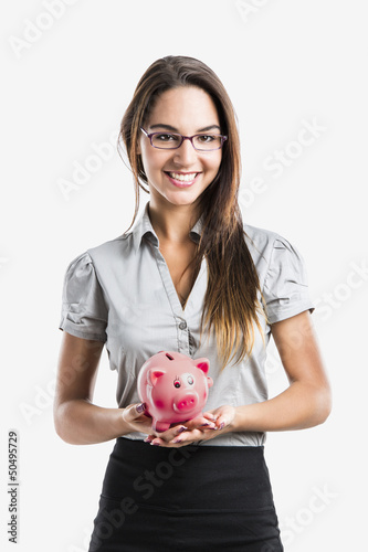 Photo: Woman holding a piggy bank Woman holding a piggy bank