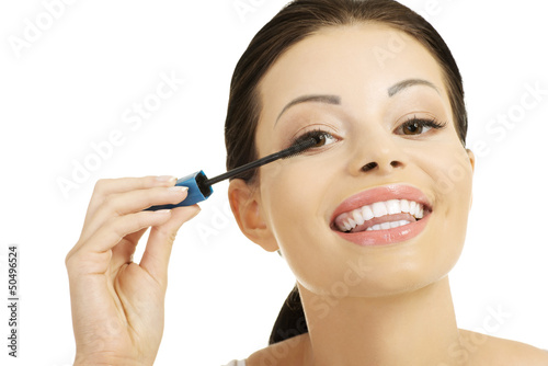 Photo: Woman face with mascara brush Woman face with mascara brush