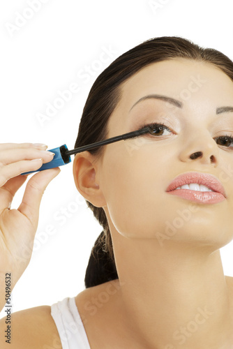 Photo: Woman face with mascara brush Woman face with mascara brush