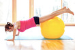 Foto: Young fit woman with fitness ball Young fit woman with fitness ball