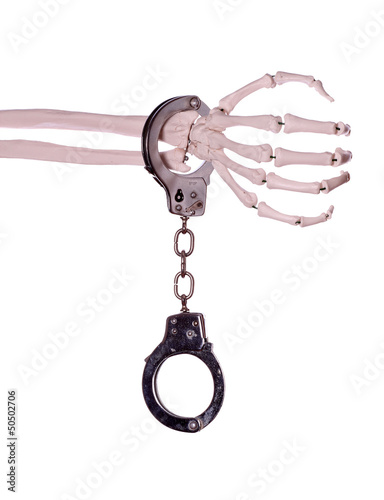 Photo: handcuff and skeleton hand handcuff and skeleton hand