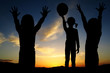 children playing and sunset evening sky