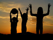 children playing in nature evening time with sunset