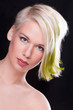 Portrait of alternative blond model with green highlights
