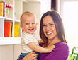 mother with laughing son looking at camera
