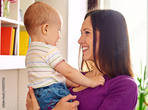 Photo: mother looking at adorable son mother looking at adorable son