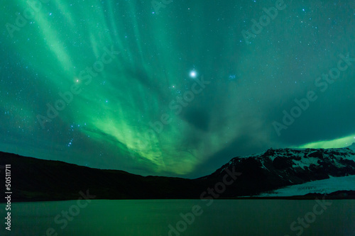 Photo: Northern lights above lagoon in Iceland Northern lights above lagoon in Iceland