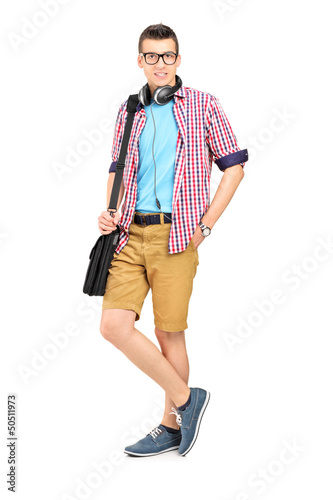 Photo: Full length portrait of a male student with a shoulder bag and h Full length portrait of a male student with a shoulder bag and h