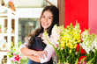 Photo: Asian Saleswoman in a flower shop Asian Saleswoman in a flower shop